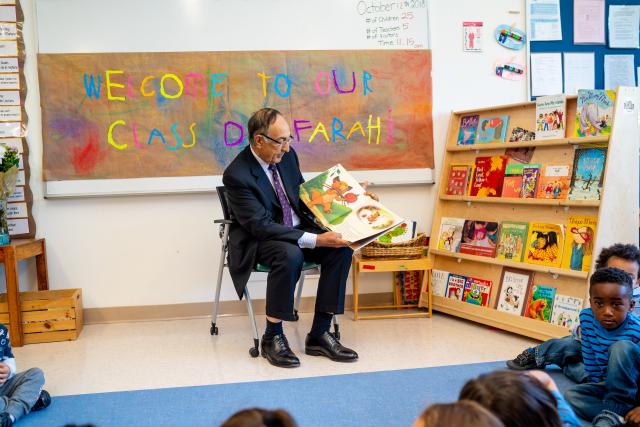 Kean President Farahi reads to a pre-school class on campus.