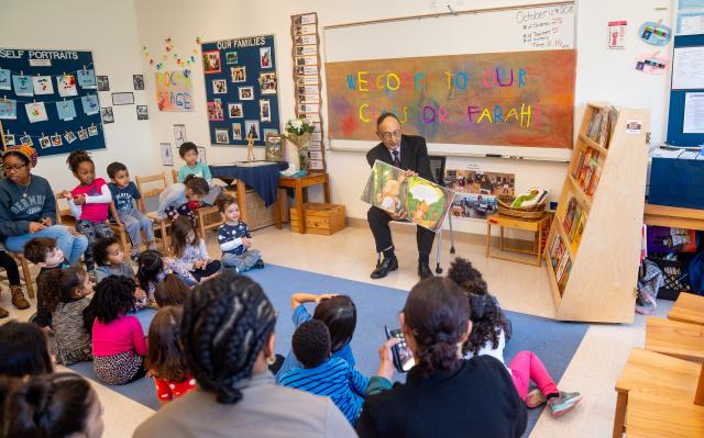 Kean President Farahi reads to children in a pre-school class on campus.