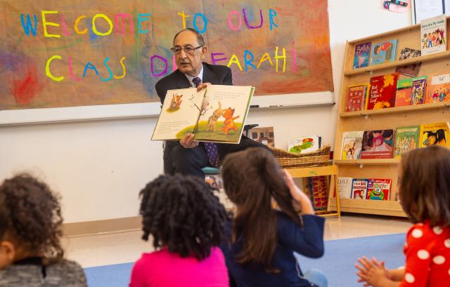 Kean President Farahi reads to a pre-school class on campus.