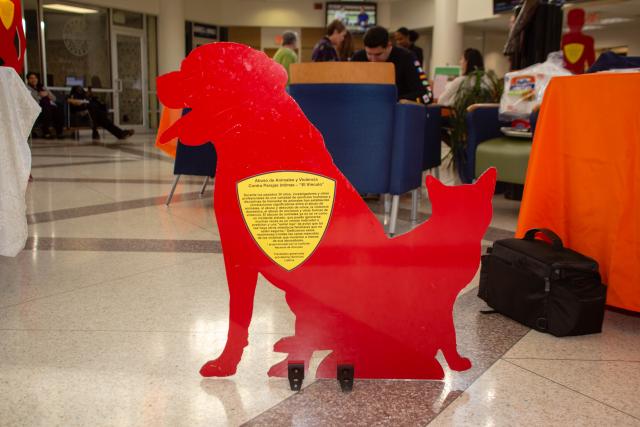 A cutout of a cat and dog are displayed in the Miron Student Center with a story written on it to testify what they heard and saw as a silent witness of domestic violence. 