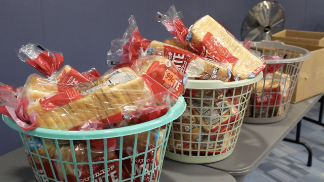 Baskets of bread sit on table