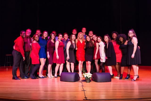 Kelli O'Hara poses with Kean students on stage