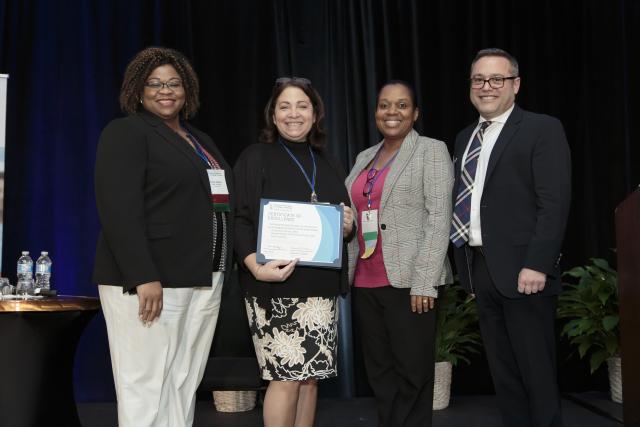 Kean University Nursing faculty pose with their nursing Excellence in Scholarship Award