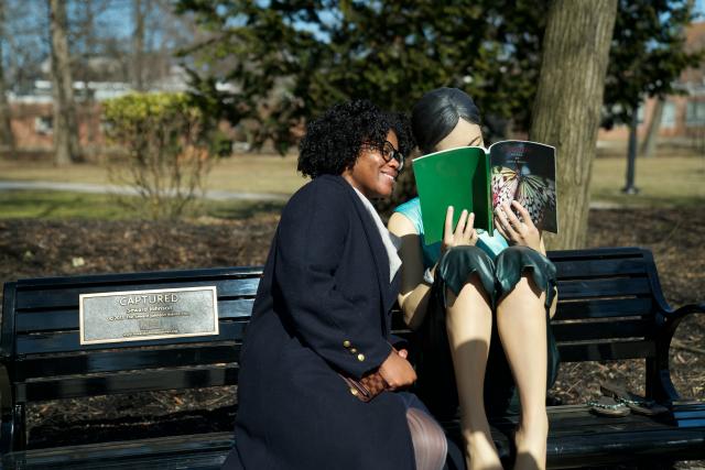 The sculpture on loan to Kean, "Captured," invites passers-by to sit and share its bench