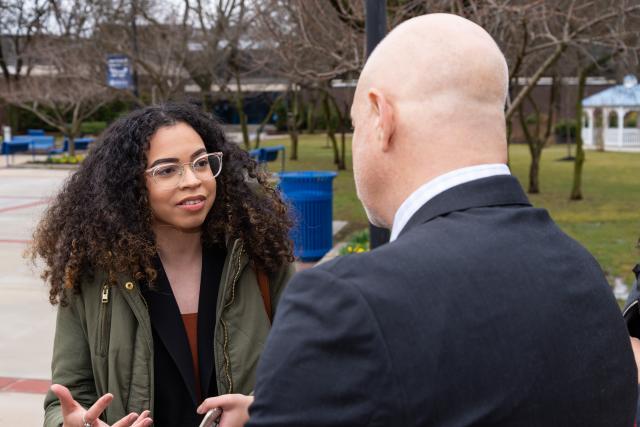 Chef Tom Colicchio talks with a Kean University student on the Union campus.