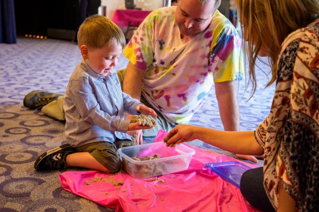 Sensory sand play was among the activities provided by graduate student volunteers