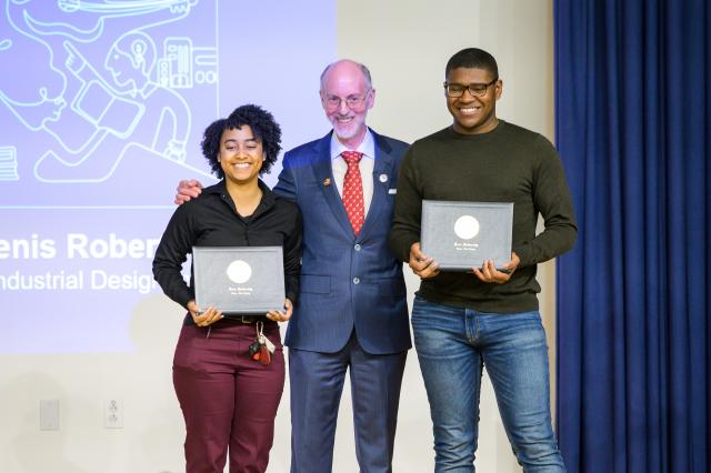 Students accept their honorable mentions awards from Dr. Toney 