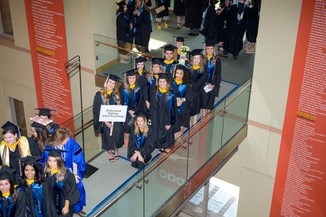 Kean graduate students line up before the commencement procession begins.