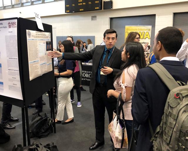 Kean University student Mitchell Lanzl presents his research at the NCUR conference