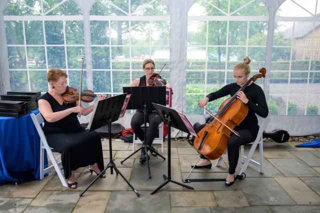 A string trio played Americana music before the swearing-in ceremony.