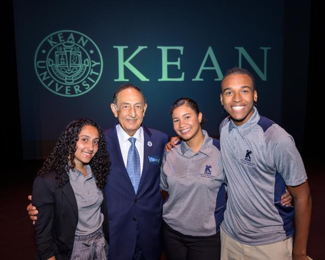 Kean President Dawood Farahi poses with Kean students.