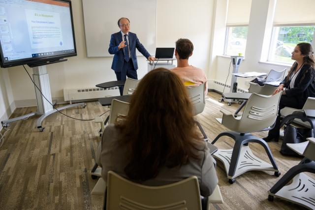 Kean Professor Shanggeun Rhee teaches a business class at Skylands.