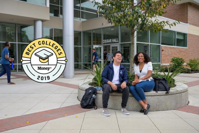 Kean students laugh on the Cougar Hall patio.