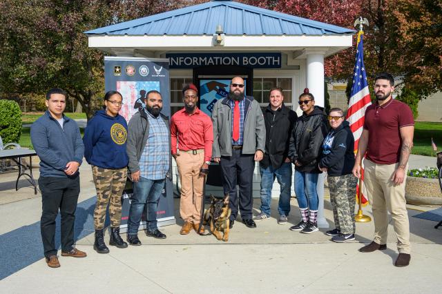 Kean Student-veteran Jason Pryor, in red shirt, received a K-9 service dog