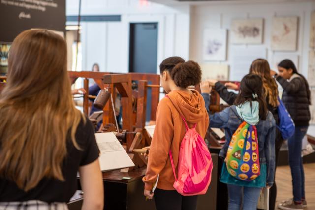 school kids try hands-on exhibits at the da Vinci exhibit