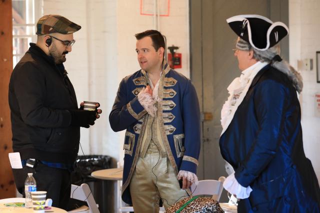 Liberty Hall 360 co-director Manny Vozos consults with actors in the film.