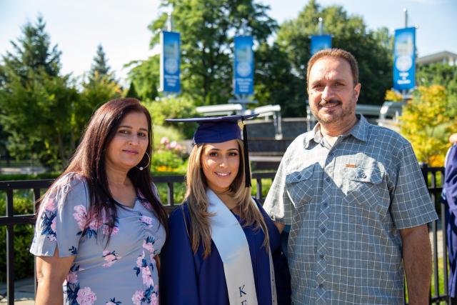 Grad poses with her family