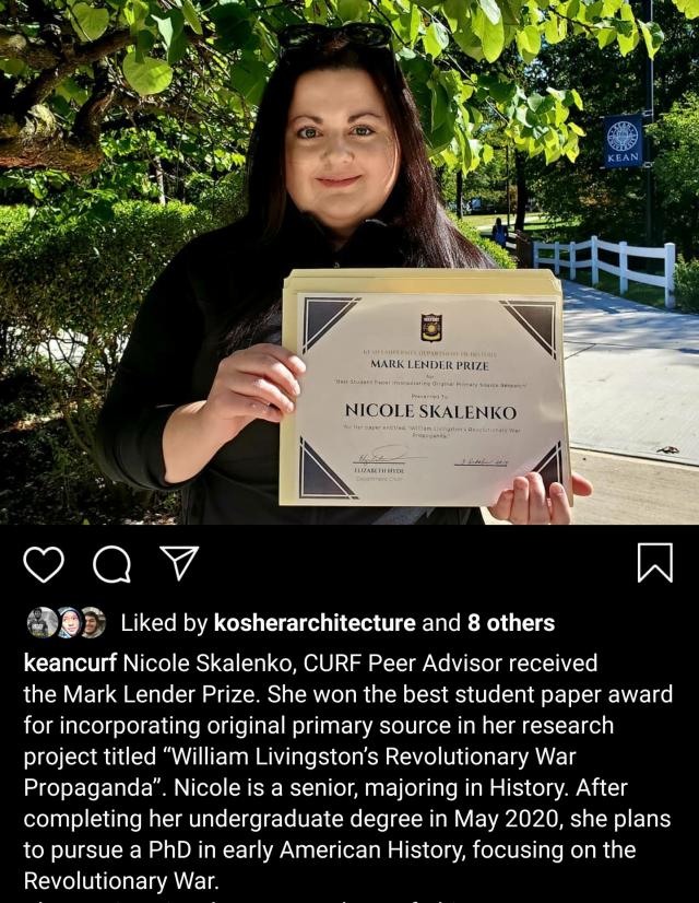 Student holding a certificate