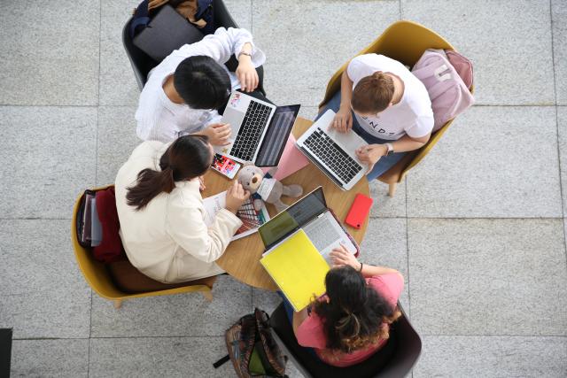 Students in a group studying,