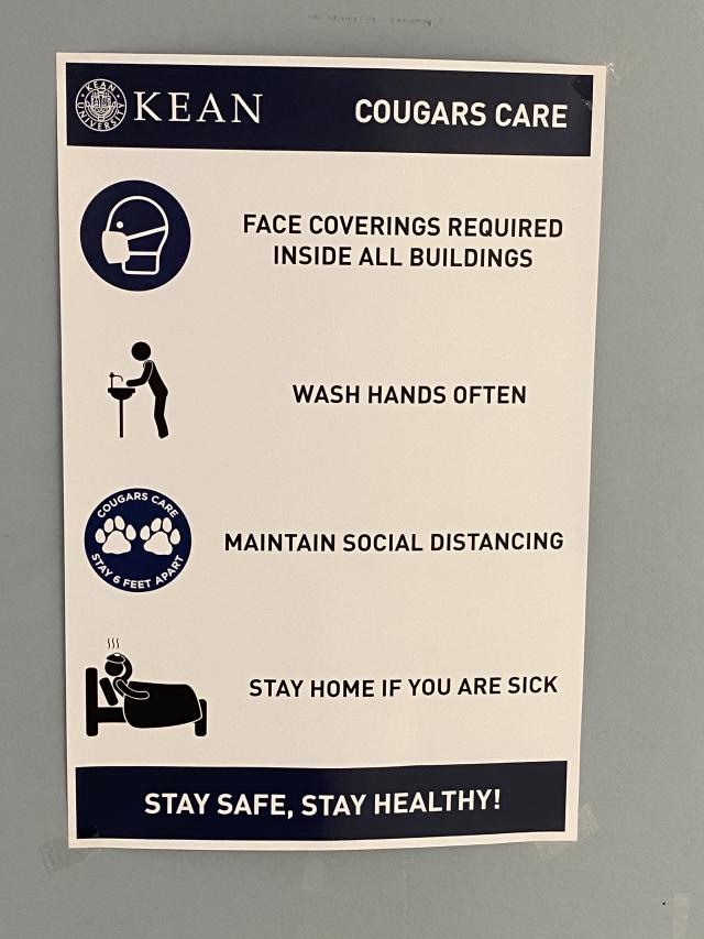Cougar cares sign - reminders: stay home if sick, wear a mask, wash your hands often, maintain social distancing