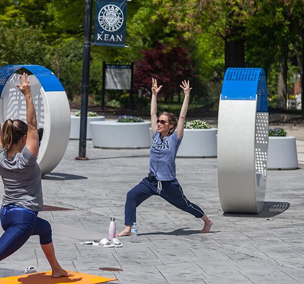 A yoga session on Kean's campus outside Miron Student Center.