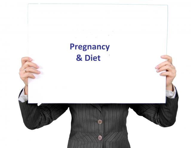 photo of someone holding a sign "Pregnancy & Diet" as a topic in the resource fair