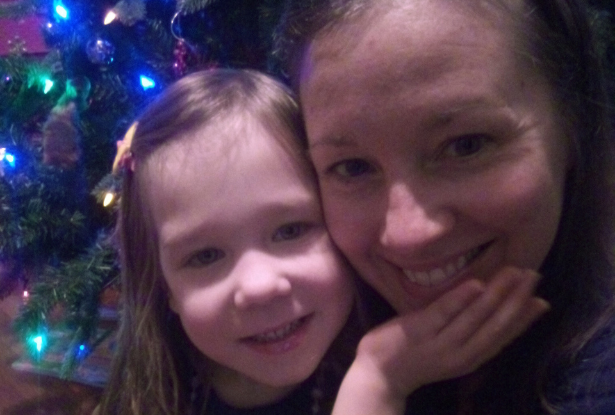 Suzanne Barich and her daughter, Addison, taking a Christmas photo.
