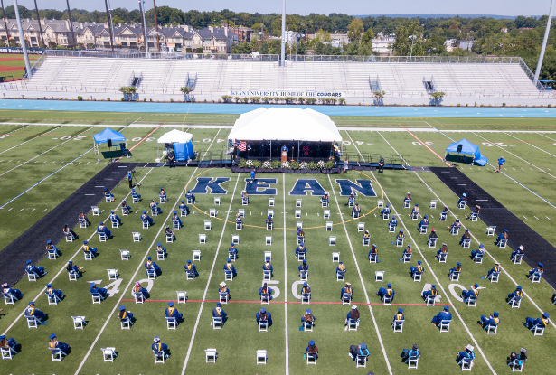 An overhead shot of 2020 Kean University graduates on the Alumni Stadium field at Commencement.