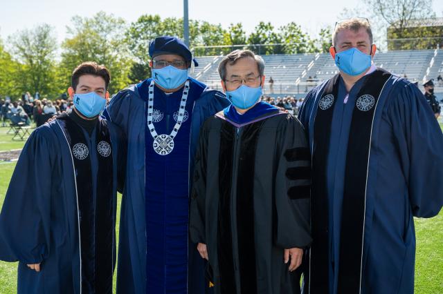 (L-R) Kean Student Trustee Jason Pleitez, President Lamont O. Repollet, Dean Jin Wang and Trustee Edward Oatman 