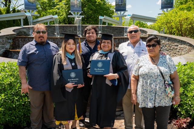 Kean 2021 graduates Priscilla and Frezia Valenzuela and their family