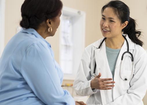 A compassionate young doctor treats an elderly patient