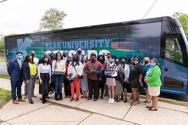 Kean University leaders traveled by bus to accept students to the Kean Scholar Academy