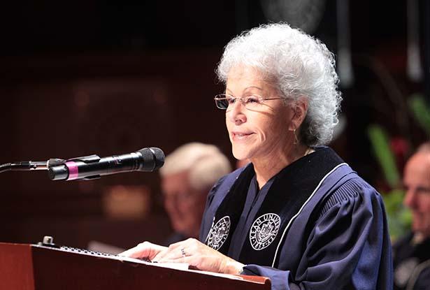 Former Kean University Board of Trustees chair Ada Morell speaks at a podium at Kean's commencement.