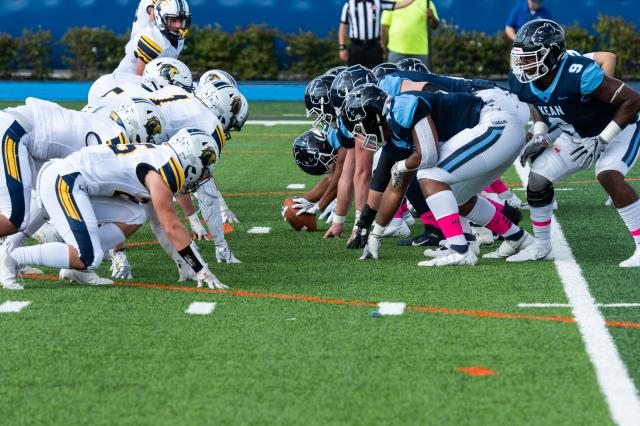 The football team in position to face the TCNJ Lions at Homecoming 2021.