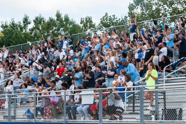 The crowd cheering for the Kean Cougars at the Homecoming 2021 football game.