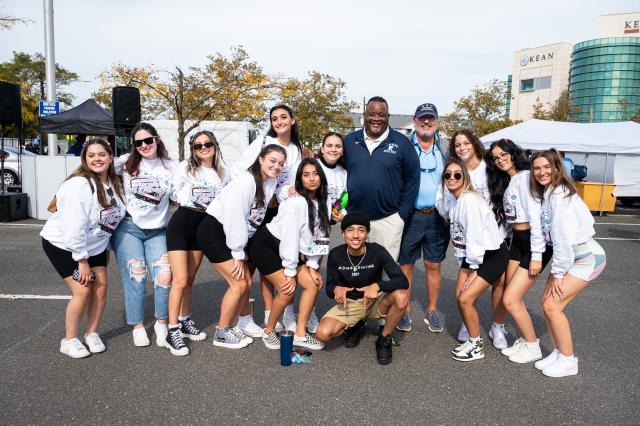 A group of students posing for a photo with Dr. Repollet at Homecoming 2021.