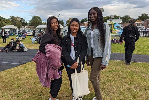 Three teenagers posing for a photo at the Jazz Roots Festival. 