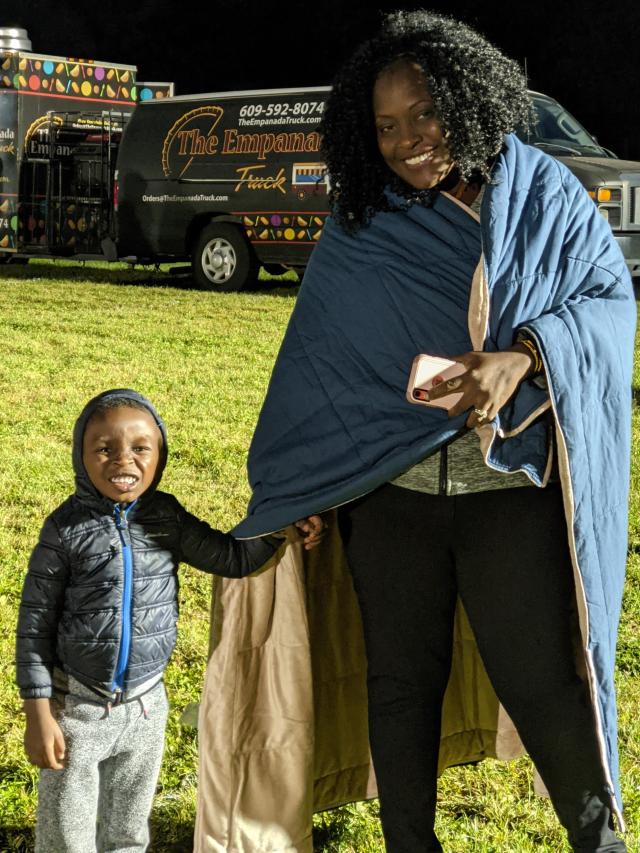 A mother and her child posing for a photo at the Jazz Roots Festival.