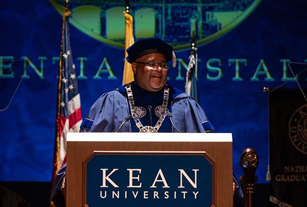 Kean President Lamont O. Repollet, Ed.D., speaks at a podium at his installation.