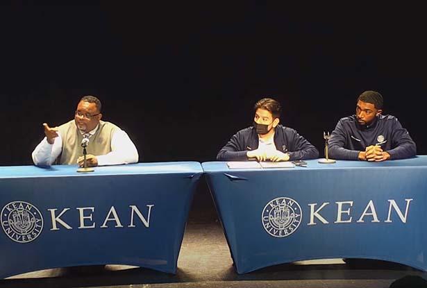 Kean President Repollet, Student Org President Pleitez and Student Trustee Robinson sit at two tables on a stage.