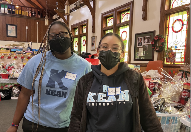 Two female students assisting in Kean volunteer event.