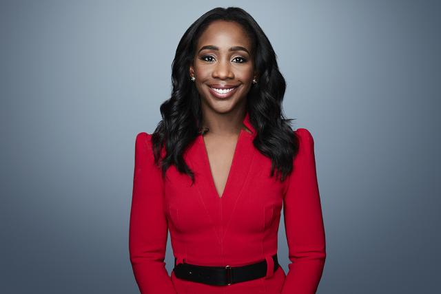 CNN's Abby Phillip wears a red dress with a black belt.