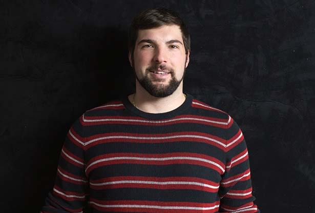 Charles Raimondo in a black, red and white striped shirt.