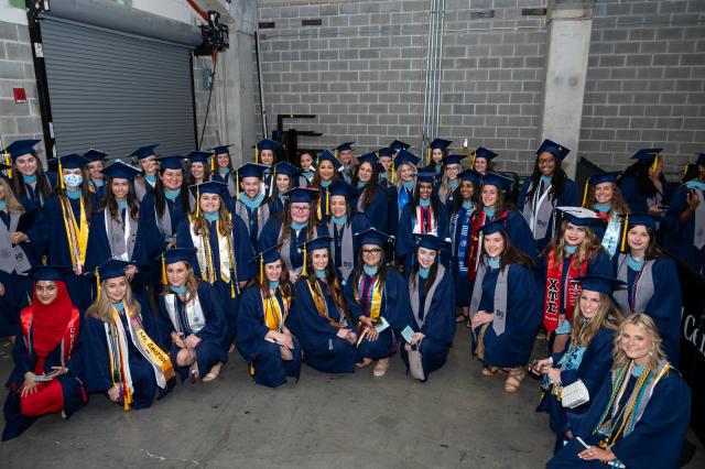 A group of Kean graduates gather before the start of the Commencement ceremony.