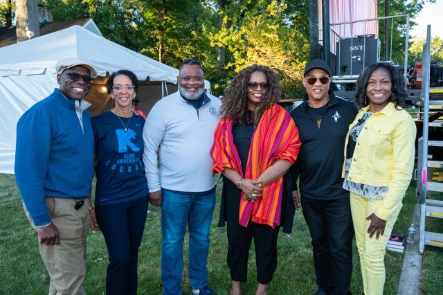 A group of people, including President Repollet and Darlene Repollet, post with Dianne Reeves.
