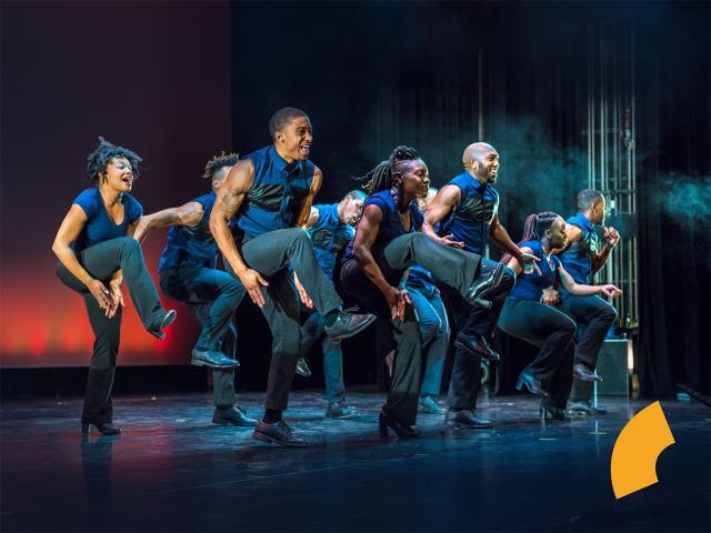 step dancers on stage, female and male alike