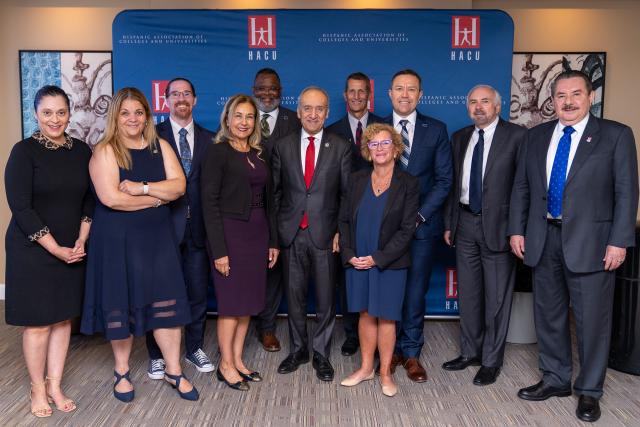 Kean President Repollet stands with a group of leaders from Hispanic-Serving Institutions.