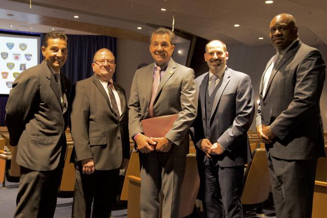 Kean public safety and administration officials pose with the Union County prosecutor.