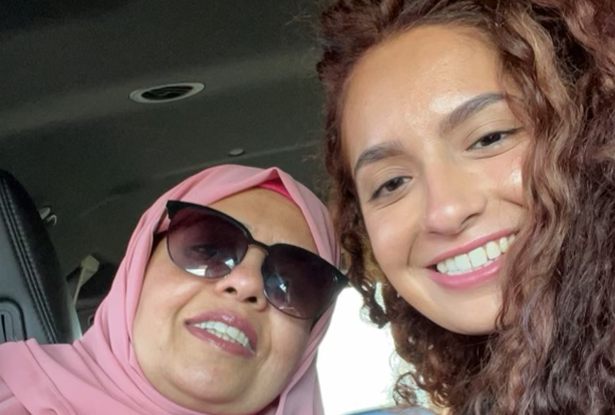 Kean alumna Rabia Ashraf and her mother posing for a selfie in a car