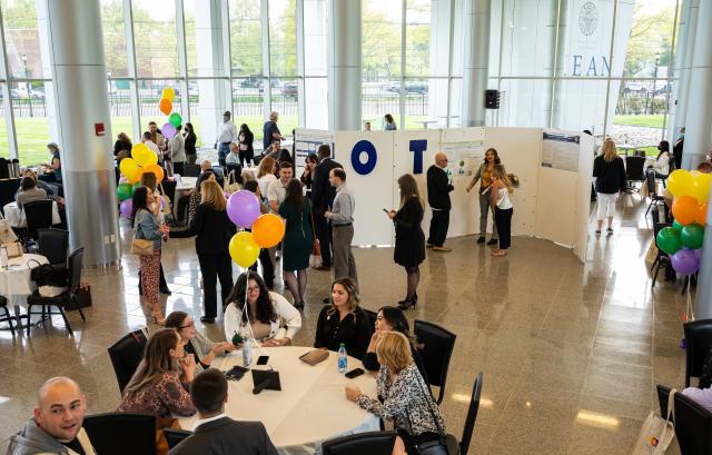 The occupational therapy department's celebration of research and practice event setup with balloons and posters